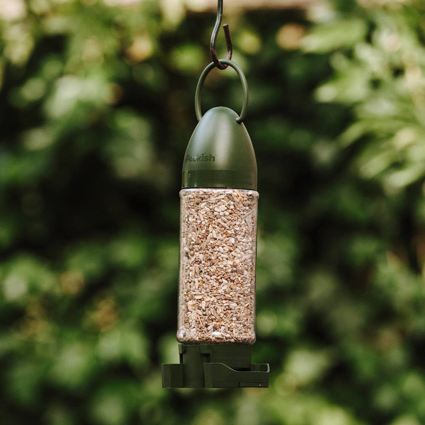 Peckish Complete Seed Mix Filled Feeder hanging in tree